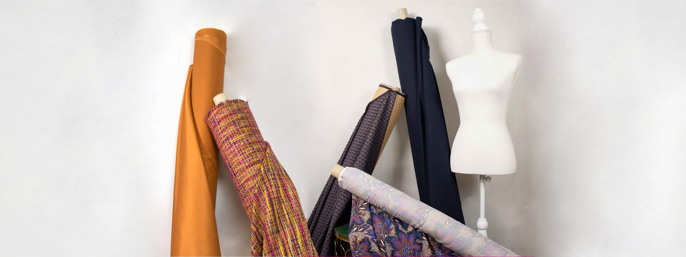 figurine-and-fabric-rolls-center